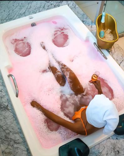 a cake shaped like a woman in a bath tub at Hotel Real in Cabo Frio