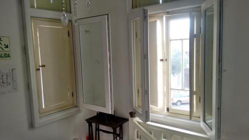 two windows in a room with a window at Casa Falleri Boutique Hotel in Lima