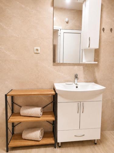 a bathroom with a sink and a mirror at Panorama Chill in Rafailovici