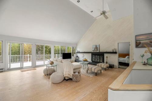 a living room with a couch and a fireplace at Southampton Beauty in Southampton