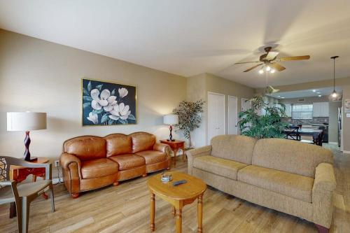 a living room with a couch and a table at Mariner Village 108 in Seabrook