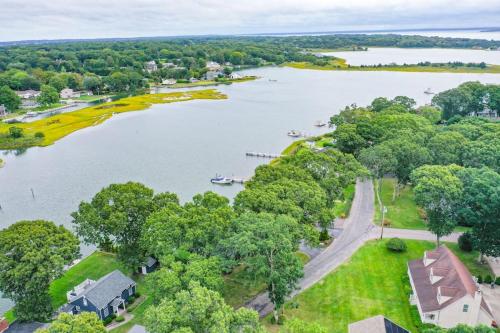 an aerial view of a lake with trees and a house at Minnehaha Marvel in Southold