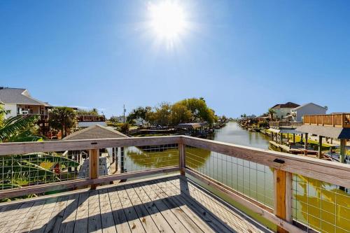 a balcony with a view of a river at Waterfront Hideaway in La Marque