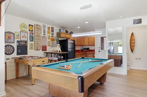 a kitchen with a pool table in a room at 5471 - Resting Beach Face in Nags Head