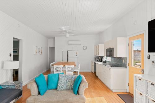 a living room with a couch and a kitchen at 10 Cayuga in Ocean Bay Park