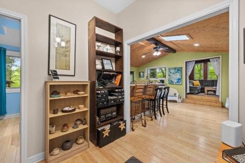 a home with a dining room and living room with a kitchen at Cozy waterfront cabin with fire pit in Old Hickory