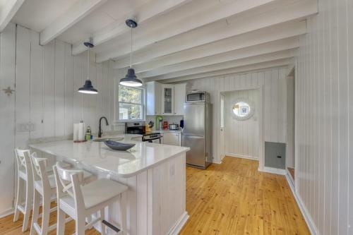 a kitchen with a large white island in a room at The Surfcomber Unit 3 in Ocean Bay Park