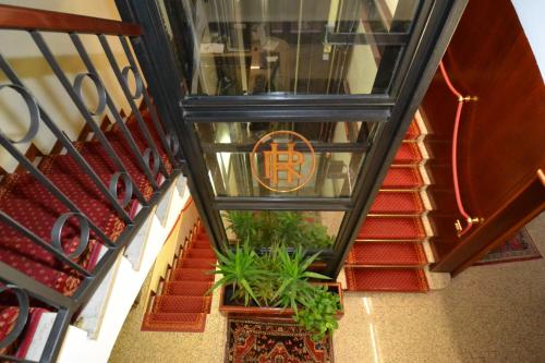 an overhead view of a stairway with plants on it at Hotel Residence in Parma