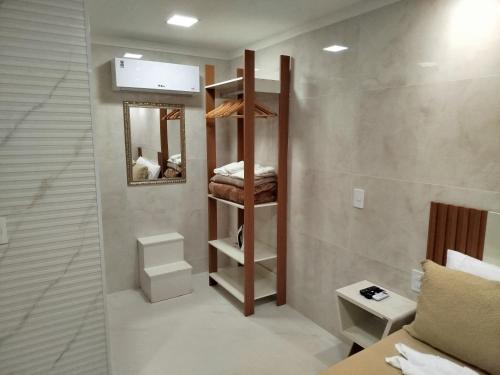 a bedroom with a bunk bed in a room at Flat Sognare Uno in Santa Teresa