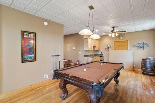 a living room with a pool table in it at Pinecone Manor Beech Mountain in Beech Mountain