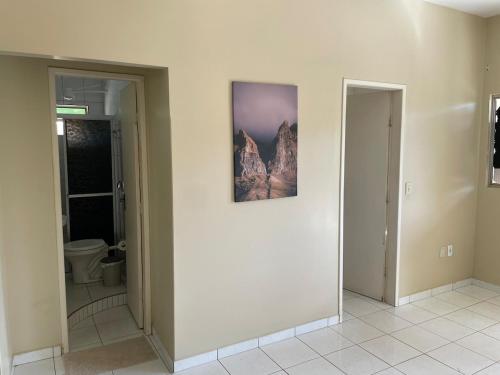 a room with two doors and a picture on the wall at Apartamento em Seabra in Seabra