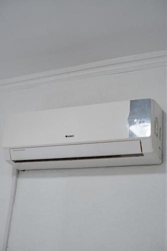 a white microwave oven with a box on top of it at Алматы Транзит №1 in (( Turksib ))