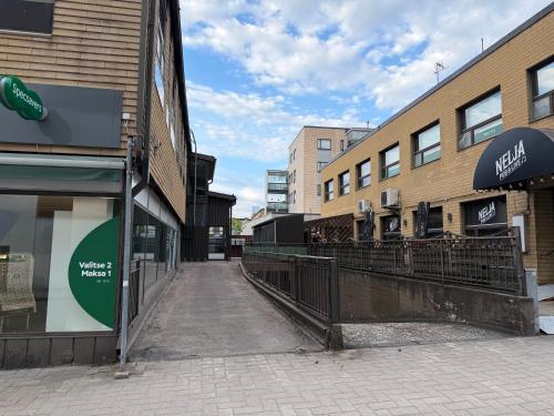 an empty street in front of some buildings at Office to sleep in heard of Lohja in Lohja