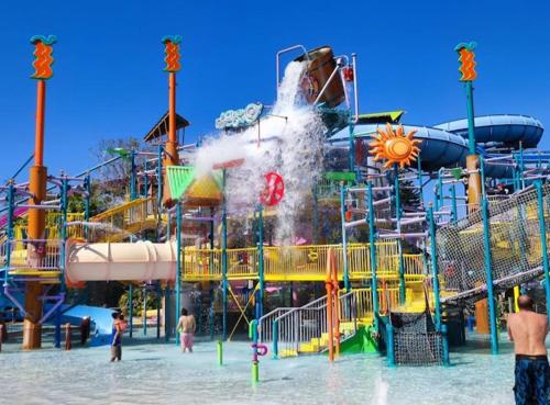 a water park with a water slide in the water at SpaceX R3 Shared in Orlando
