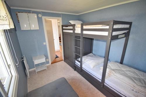 a bedroom with two bunk beds in a room at "Haus Sjöholmen" in Vetlanda