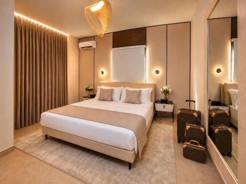 a bedroom with a large bed in a room at Elite Residence in Accra