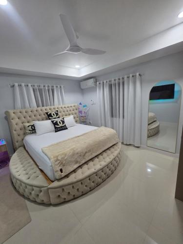 a bedroom with a large bed in a room at House of Harmony in Portmore