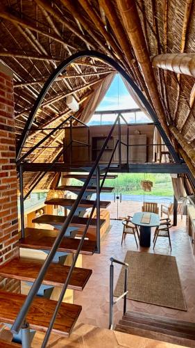 a spiral staircase in a room with a brick wall at Viento Blanco in Independencia