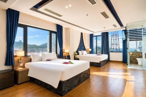 a hotel room with two beds and a view at W Premium Nha Trang in Nha Trang