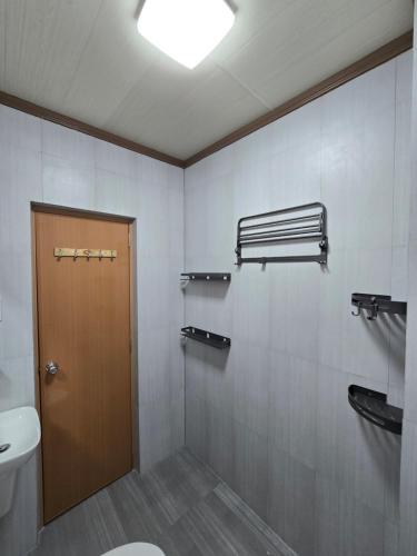a bathroom with a toilet and a sink at MSD Resort Hotel in Bengcag