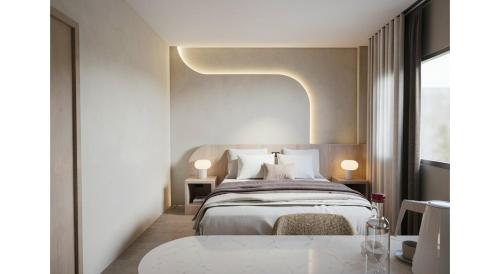 a bedroom with a large bed and a table at Eurana Boutique Hotel in Chiang Mai