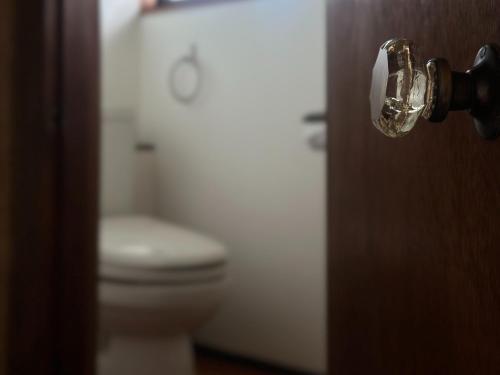 a bathroom door with a toilet in the background at sikari Vacation STAY 95401v in Takashima