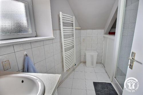 a small bathroom with a sink and a toilet at Le clos rucharet in Saint-Carreuc