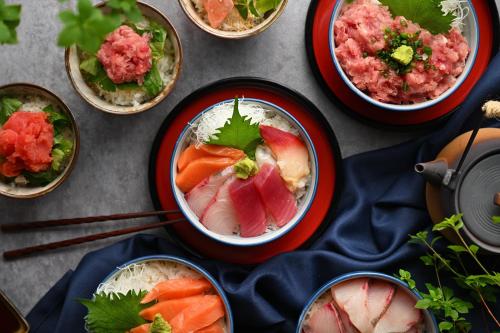a table topped with bowls of food on a table at Iwaki Washington Hotel in Iwaki