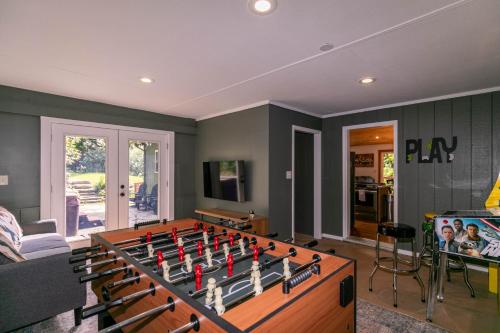 a living room with a foosball table at Snaggys Retreat in Boone
