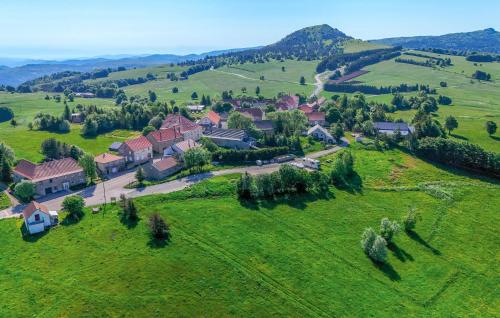 an aerial view of a house in a green field at Elegant Apprt in Lachamp-Raphaël