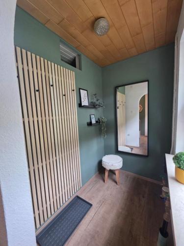 a room with a large door and a mirror at Haus Thieke in Rhederfeld