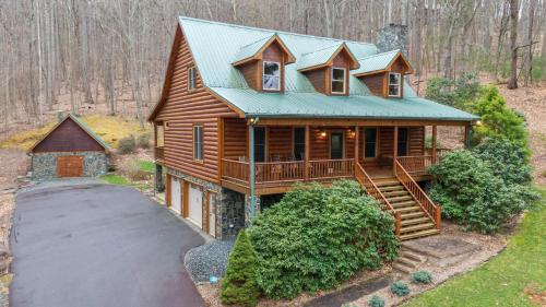 an overhead view of a log cabin with a porch at The Forge in Lansing