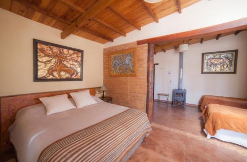 Giường trong phòng chung tại Solar del Tropico