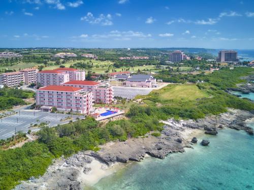 an aerial view of a resort next to the water at Hot Cross Point Santa Monica in Miyako-jima
