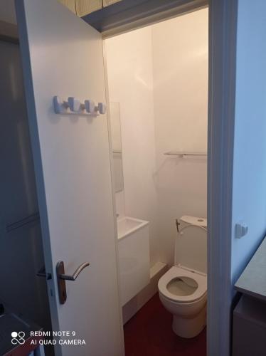 a bathroom with a white toilet in a room at GautierNice in Nice