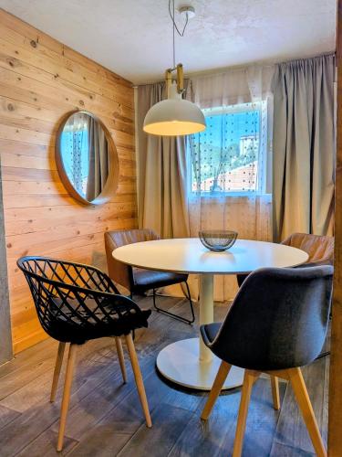 a dining room with a table and chairs at Apartments 18 - Central & Cozy in Velingrad