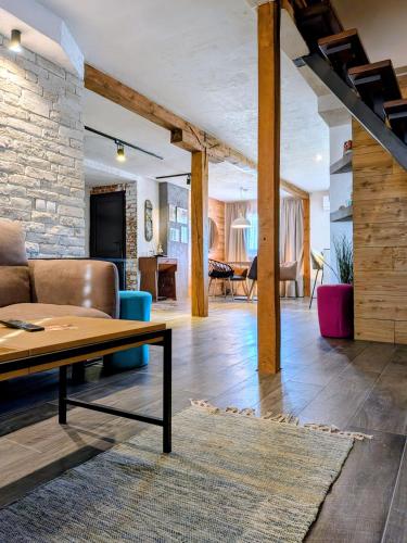 a living room with a couch and a table at Apartments 18 - Central & Cozy in Velingrad