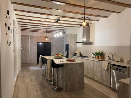 a large kitchen with a large island in the middle at Casa Bethel in Chella