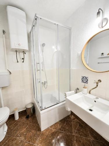 a bathroom with a shower and a sink and a toilet at Garden House Tučepi in Tučepi