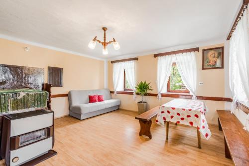 a living room with a couch and a table at Holiday house Pod Ledinco in Most na Soči