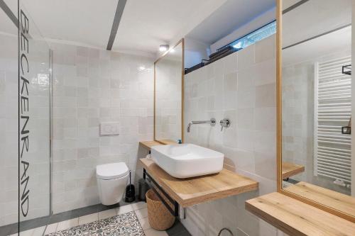a bathroom with a sink and a toilet at Waldwagen Altes Forstamt Sinntal in Sinntal
