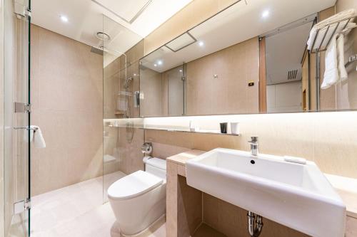 a bathroom with a sink and a toilet at Days Hotel by Wyndham Seoul Myeongdong in Seoul
