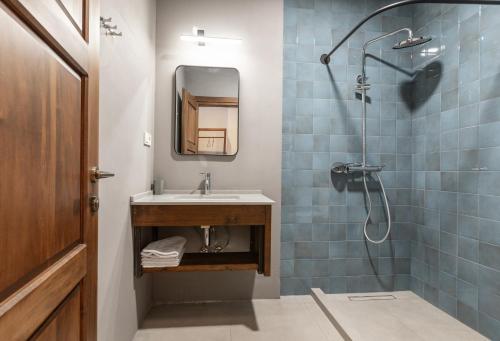 a bathroom with a sink and a shower at Lasiim in Mestia
