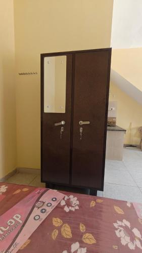 a pair of lockers in a room with a bed at The Stay Spot in Kharar