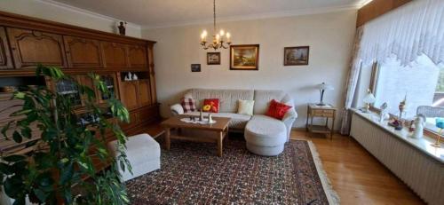 a living room with a couch and a table at FeWo Christa in Marpingen