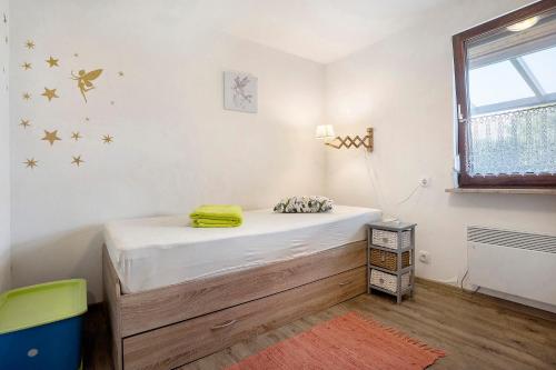 a bedroom with a bed in a room at Ferienhaus Cajo in Dahmen