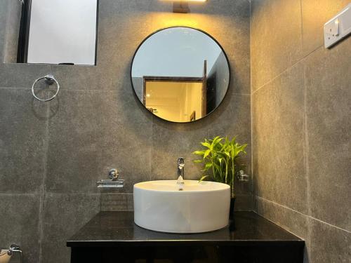 a bathroom with a sink and a mirror at AB Villa in Hikkaduwa