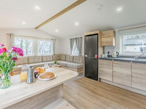 a kitchen with a table with a plate of food on it at No29 - Uk52060 in Hartland