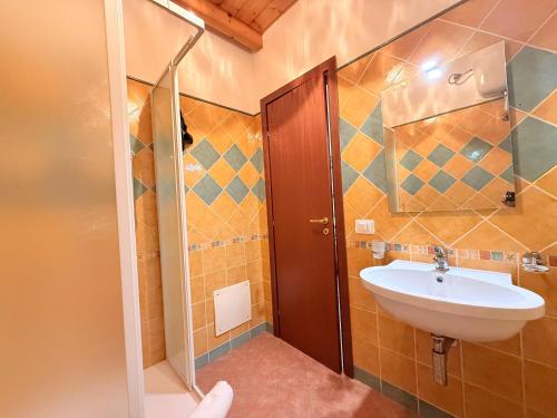 a bathroom with a sink and a shower at Casa Cinema Paradiso in Cefalù