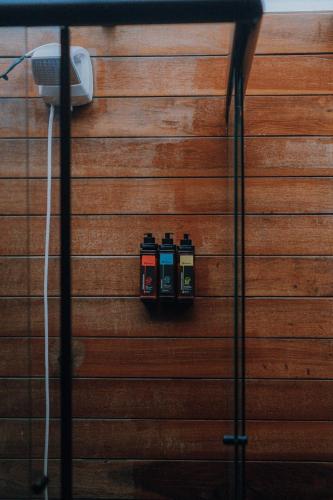 a wall with three electrical sockets on it at Pacas Suítes Lençóis Eco Lodge in Santo Amaro